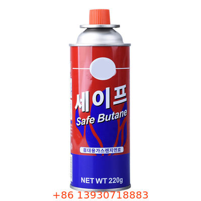 شیر اسپری اجاق گاز بوتان با درپوش قرمز برای پیک نیک و آشپزی روی میز